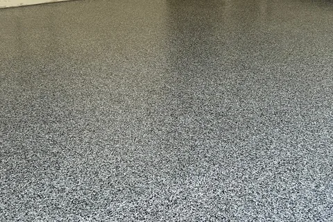 Glossy black, gray and white flake garage floor.